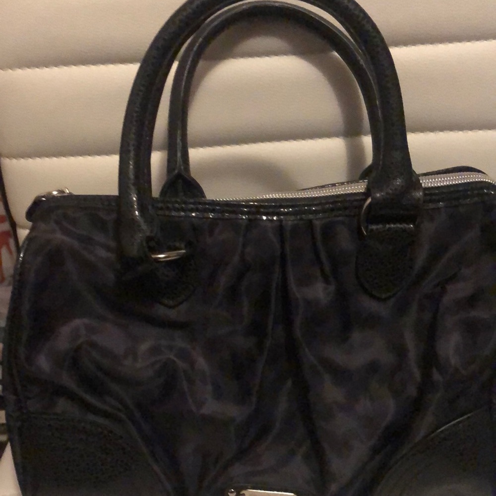 Animal print Victoria secret bag zips closed